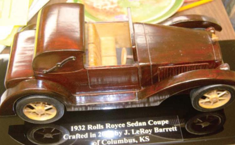 A new entry in the Mae Sherwood Art wing of the Columbus Museum is currently on display. The handcrafted replica of a 1932 Rolls Royce Sedan Coupe was made by the late CCRHS graduate J. Leroy Barrett. This piece of art is unique because it is made of wood from trees grown on farms in Cherokee County. This artifact is not old, but it is a work of art.