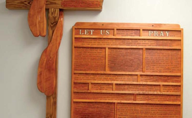 This woodwork wall hanging was made by Brad Gleason, father of Matthew and hangs in the St. Rose Parish Hall in Columbus. Gleason’s artwork was brought to the church earlier this year. “Apart from the Cross there is no other ladder by which we may get to Heaven,” a quote from St. Rose of Lima is on the cross.