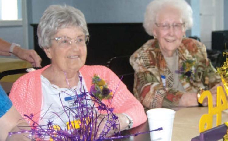 The Mineral All-School Reunion was well attended Saturday evening at the Old Parita Ballroom in Carona. JoAnne Sheidler and Virgina Robinson Moore, the oldest grad attending, visit before dinner.