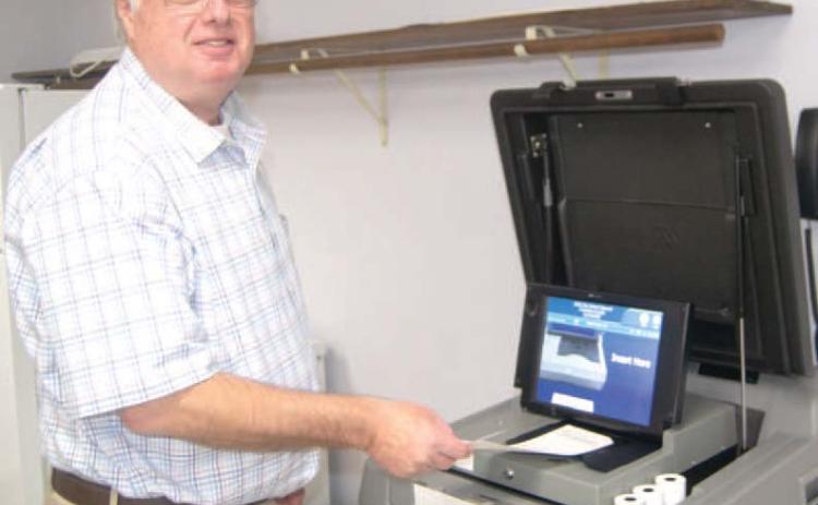 Casting his vote Doug Hall was voting at the Extension Office on Tuesday afternoon. The turnout was light with 1,874 votes out of 15,601 registered.
