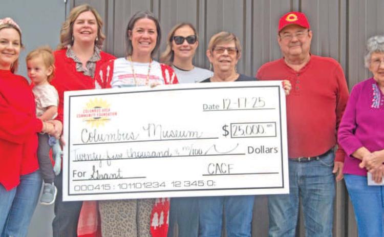 The Columbus Area Community Foundation recently presented a $25,000 dollar check to the Columbus museum for the new sports addition. Columbus Area Community Foundation members Christine Parsons, Jamie Robinson, Kelly Walters, and Maddy Foster were on hand as museum board members Anita Davolt, Ron Holmes and Ella Buzzard accepted the check. News Report photo by Shawn Churchill.