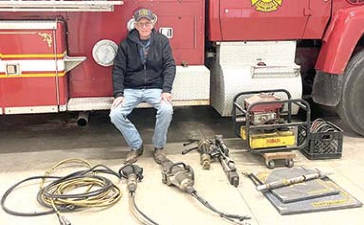 West Mineral Fire Chief Randy Johnson surveys the extraction equipment his department received from the Columbus Fire and Rescue to help improve rescue service in the northern part of the county.