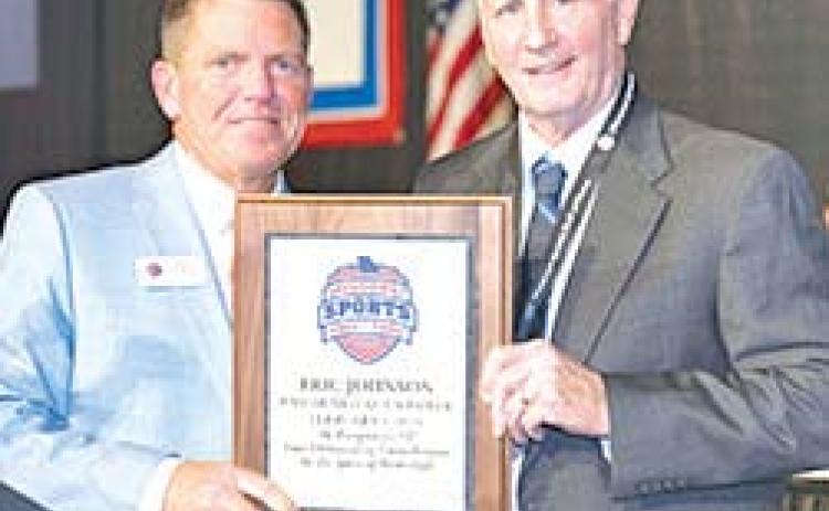 Former Columbus Titan Basketball Coach, Eric Johnson, was enshrined into the Missouri Sports Hall of Fame, in a ceremony February 1 with the Class of 2026. He received a commemorative plaque from Bob Marsh, President and CEO of the Hall of Fame during ceremonies in Springfield, Mo. Photo courtesy of Miles Boyer Photography.
