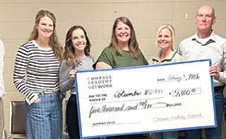 Members of the USD 493 Board of Education and Superintendent Dan Grundy were presented a Partner Grant for outstanding efforts and participation in the 2025 Compass Academy Network summer program. Courtesy photo.