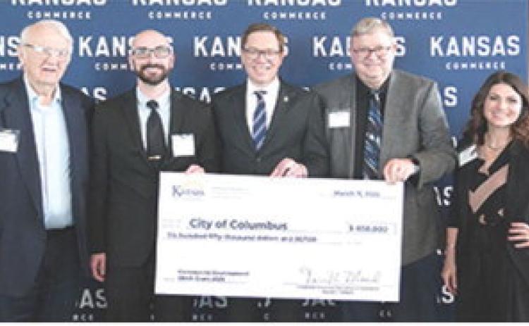 Columbus City Council member Tom Pryor, City Administrator Jake Letner, Mayor Grant Spieth were in Topeka last week to officially receive a $650,000 CDBG award. The check was presented by Lt. Gov. David Toland, and Brytonee Kepley a grants specialists with CBDG. These funds will support sewer improvements designed to reduce stormwater inflow and infiltration while enhancing the overall functionality of the system. Courtesy photo.