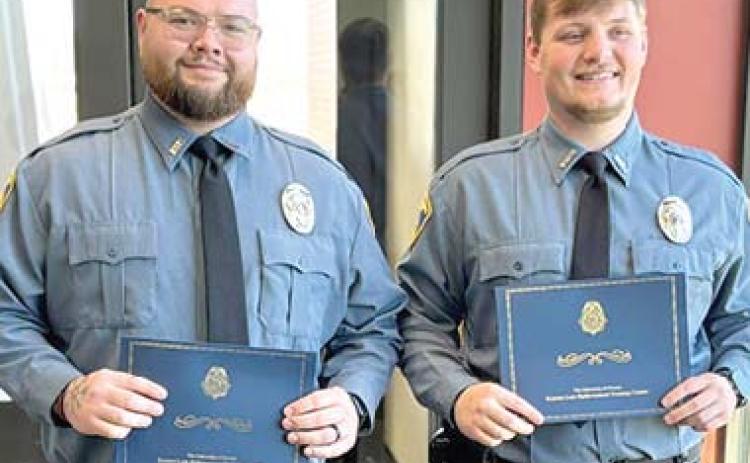Two officers with Baxter Springs Police Department recently graduated from the police academy. Nigel Garner and Luke Gunn will now be patrolling in Baxter SprCinogusr.t esy photo.