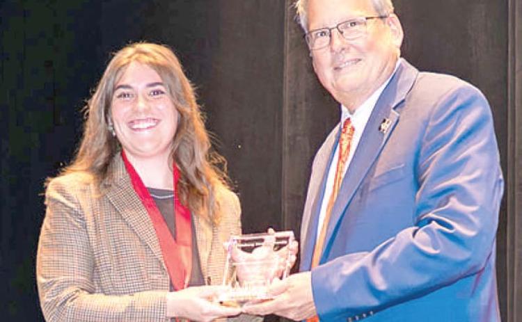 Kate Tyree, 2020 Riverton High School graduate was named Pittsburg State University student employee of the year. PSU President Thomas Newsom presented the award. Courtesy photo.