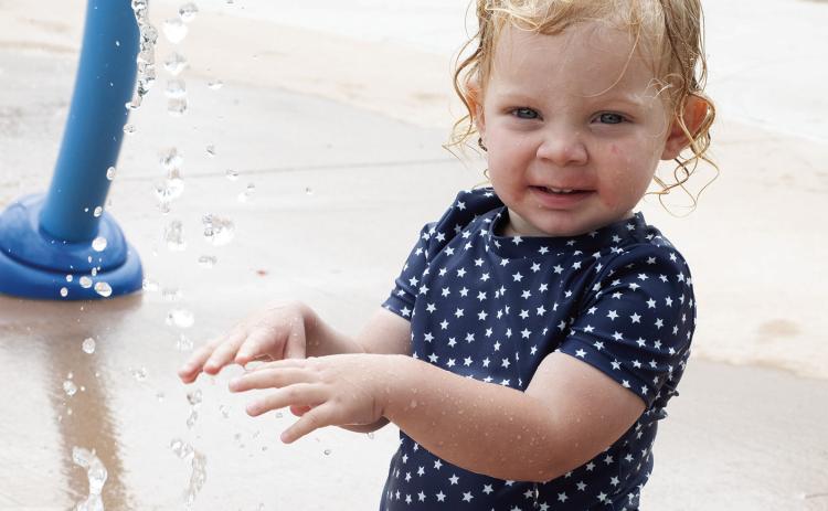 On a warm day there is no place like the Columbus splash pad for cooling off. Inola Smith was enjoying the morning with some fun in the water.
