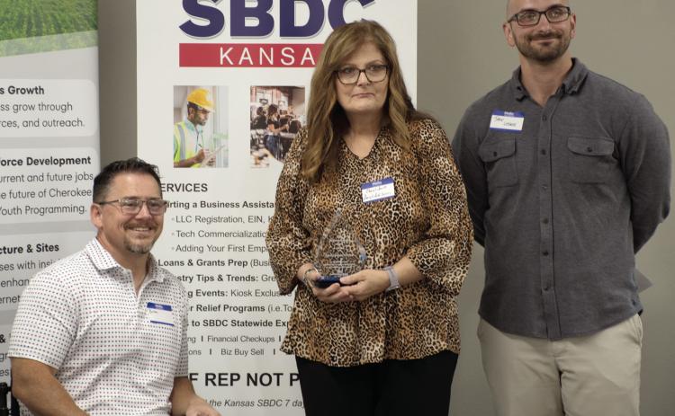 CCEDC Chairman Brian Smith, Left, and Vice-Chairman Jake Letner, right, presented the Business Growth award to Darryl’s Auto Service in Baxter Springs. Receiving the award on behalf of the business is Cheryl Jones.