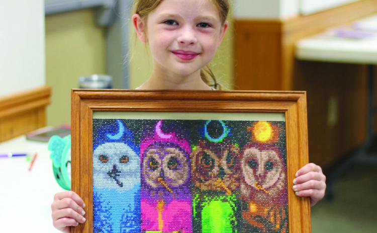 Sofia Elmore created this diamond art picture of owls for the Craft show during the Cherokee County Fair. Elmore is a member of Spring Valley Sparklers.