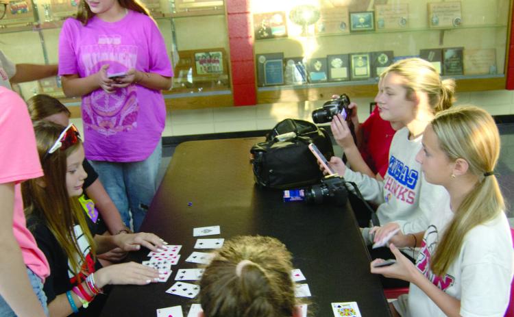 Recently Columbus Fellowship of Christian Athletes hosted other area FCA groups at an activity night. Students played a variety of games including cards (above) and also had food and drinks (below). There was also a special speaker for the event.