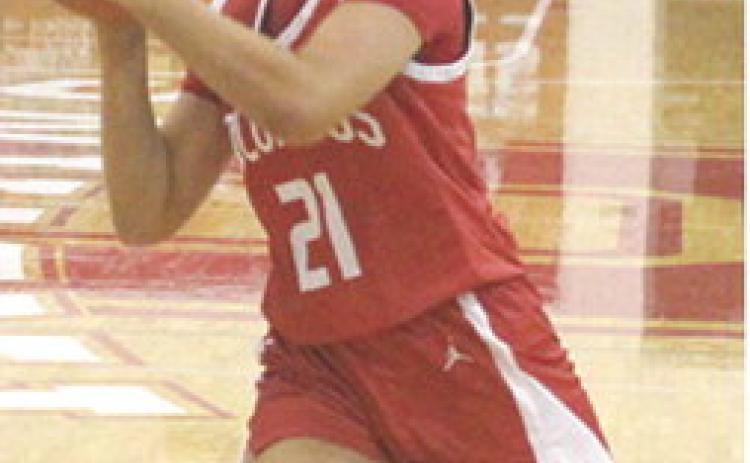 Lady Titan Sophomore, Americus Woodcock, drives to the basket in the Lady Titan, 31-28, win over Oswego, December 4. Americus scored six points in Monday’s loss at Liberal, 28-34.