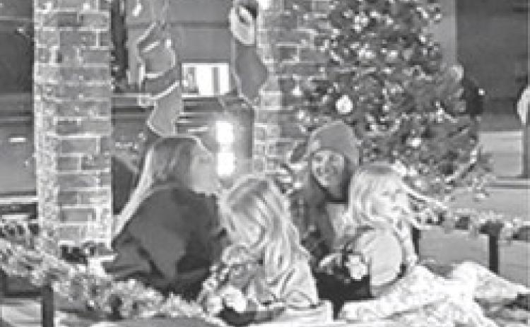 Making sure the stockings were hung by the chimney, the riders of this float were ready for a Merry Christmas at the annual Columbus Parade
