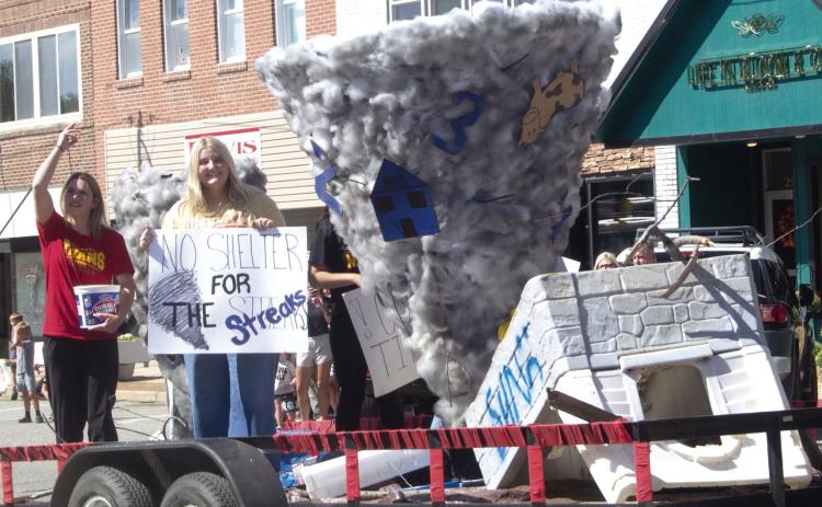 Above the senior class float proclaims “No shelter for the streaks”. Below the junior class float sported a football field themed creation. The Titans played Neodesha for their homecoming game.