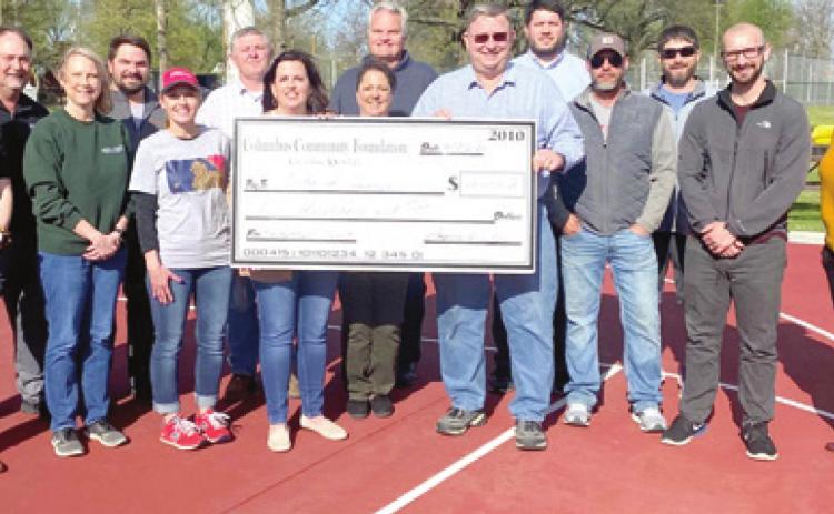 Foundation members from the left are: Maddy Foster, Dave Schoech, Janet Graham, Matt Case, Angie Saporito, Danny Langerot, Jennifer Thompson, Sonja Duley, and Doug Mogle. Mayor Grant Spieth is shown on the right of the check making the acceptance. Shown next in the back are Clint Ellis and Dan Walters of the Columbus Recreation Commission. In front of them are Randy Coble, Jake Letner and Daniela Rivas with the City of Columbus. Courtesy photo.