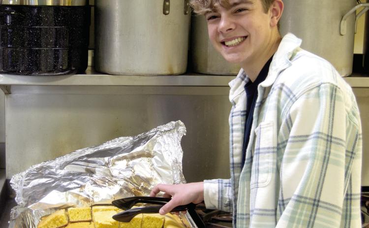 It is the time of the year for organizations to have fundraisers with local favorites from the kitchen. The Columbus Lions Club held their annual Bean or Vegetable Soup feed at the St. Rose Parish Hall on Thursday, March 6. Easton Long, a member of the Leo Club at Columbus High School helped serve the homemade cornbread.