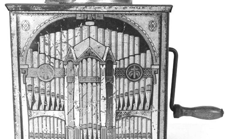 Tin lithograph music boxes like this one turned a luxury item into a simple toy. Their graphics usually featured instruments or musicians. Photo Credit: Copake Auction Inc.(c) 2026 by Cowles Syndicate Inc.