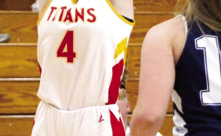 Lady Titan Bentley Townsend, scores two of her eight points in the eighth grade A, 20-23 loss to Galena, Tuesday at the CUHS Gymnasium.