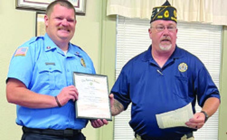 An award for Firefighter of the Year was presented to Baxter Springs Firefighter John Hunt by Baxter Springs American Legion President Daryl Nadeau at a recent meeting. Courtesy photo.