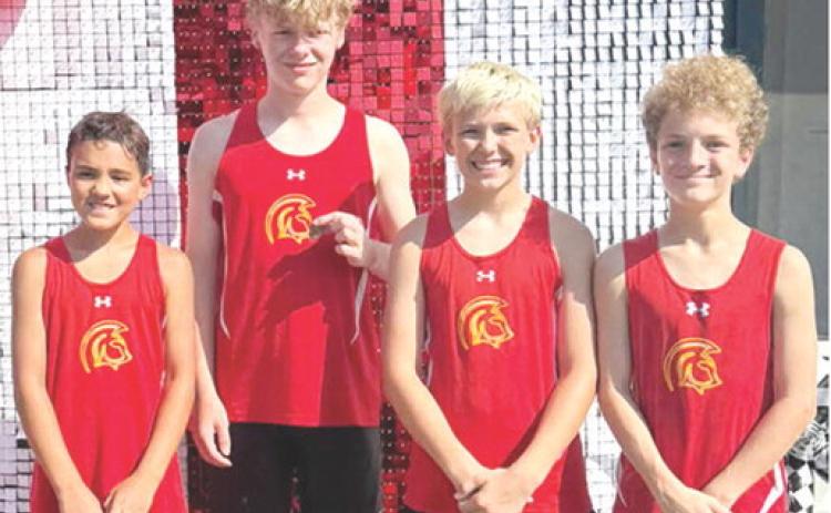 The Columbus Junior High School Seventh Grade Boys Cross Country Team placed first at the Oswego Invitational Meet, Thursday, in Oswego. Team members, Kross Davis placed 15th; Eamon Wilkins placed sixth; Lucas Epler placed ninth; and Tucker Siemer placed seventh on their way to the team title. Courtesy photo.