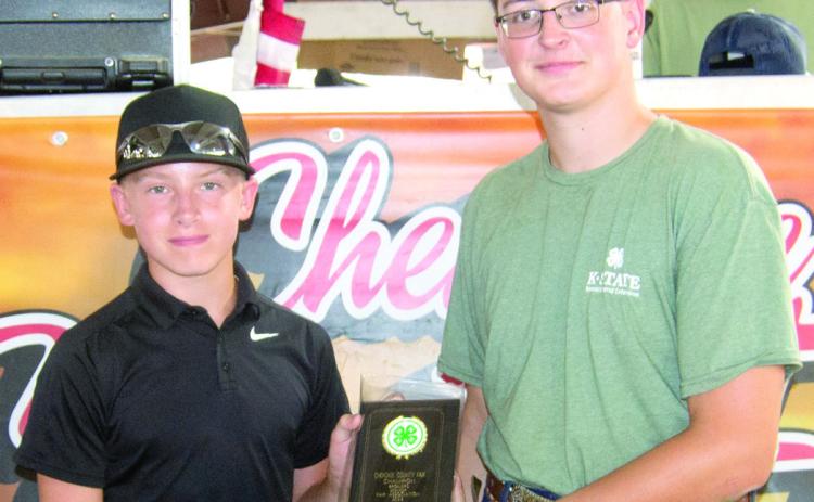 Brayden Green was presented the award for Champion Broiler by Fair King Eli Pritchett.