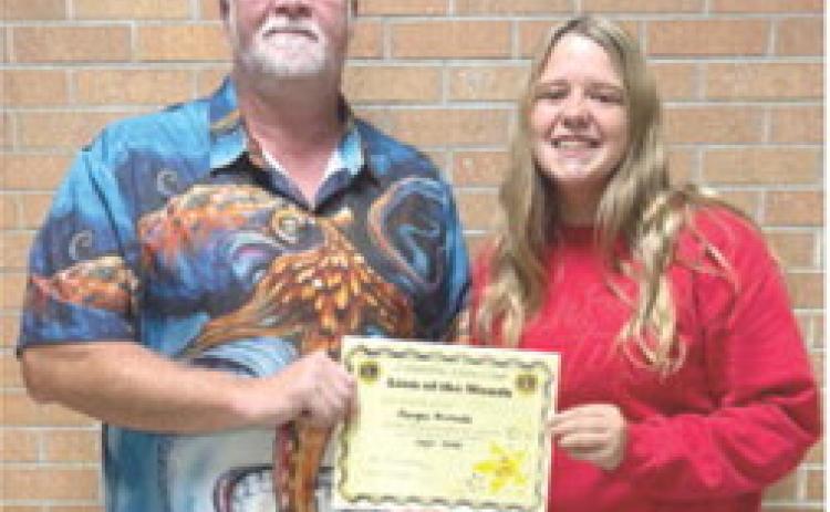 September Lion of the Month was presented to Morgan Richards by Lion Buddy Derfelt. Morgan is active in Band, Jazz Band, Volleyball, Softball, Student Council, Leo Club, Pep Club, Math Team, FCCLA, and Chick-fil-a Leadership Academy. Courtesy photo.