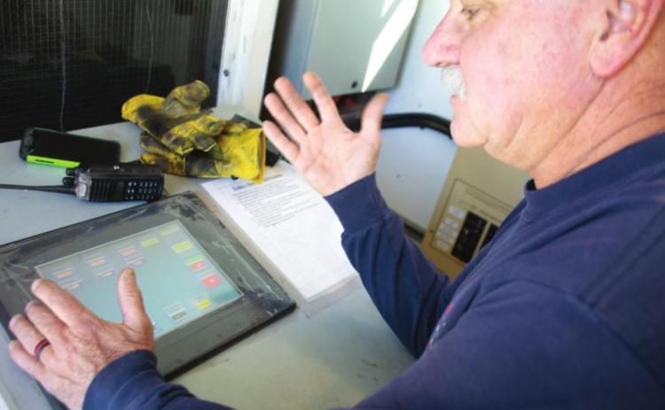Kansas University Fire instructor, Rick Deibert, also is Fire Chief at Shawnee Heights Fire Department controls the fire from inside a booth in the truck. He has control of the fire and the operation, watching from behind a heat proof glass.