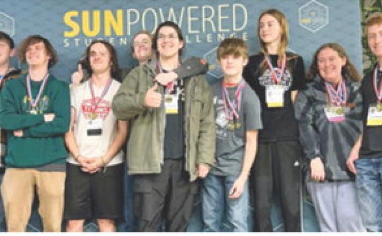 Columbus students Brenden Maxton, Kinden Riddle and Gabe Edwards were on the team that placed first in the Cooperative Challenge at the Solar Competition in Wichita in early April. Courtesy photo.