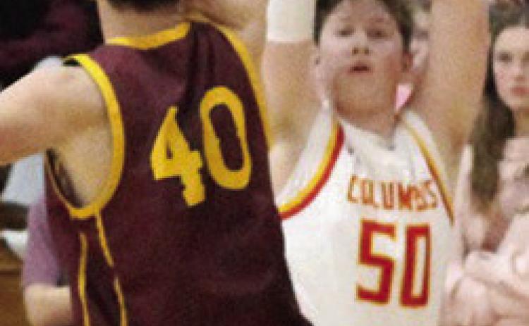 Titan Senior, Huck Hallam, gave Columbus their only lead, 3-2, with his three-point shot early in the 32-58, Columbus loss to Girard, Friday night at the, CUHS Gymnasium.