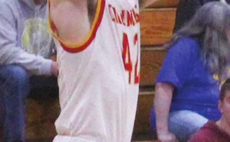 Titan Junior, Seth Stover, makes a jump shot on an in-bound play during third quarter action of the, 53- 41, Columbus win over Riverton, Tuesday night at the CUHS Gymnasium. Seth led both teams in scoring with 21 points.