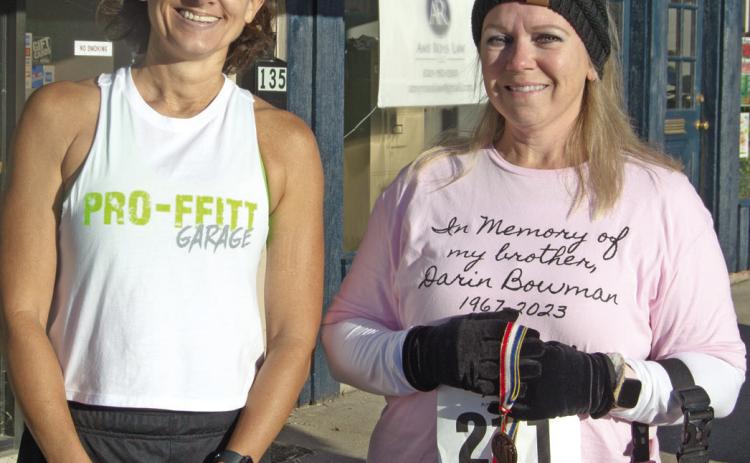 In the women’s age 50-59 division of the Columbus Day 5K, Missy Proffitt placed first with a time of 31:44. Laura Epler placed third with a time of 39:31. Not pictured, Karla Line placed second with a time of 32:45.