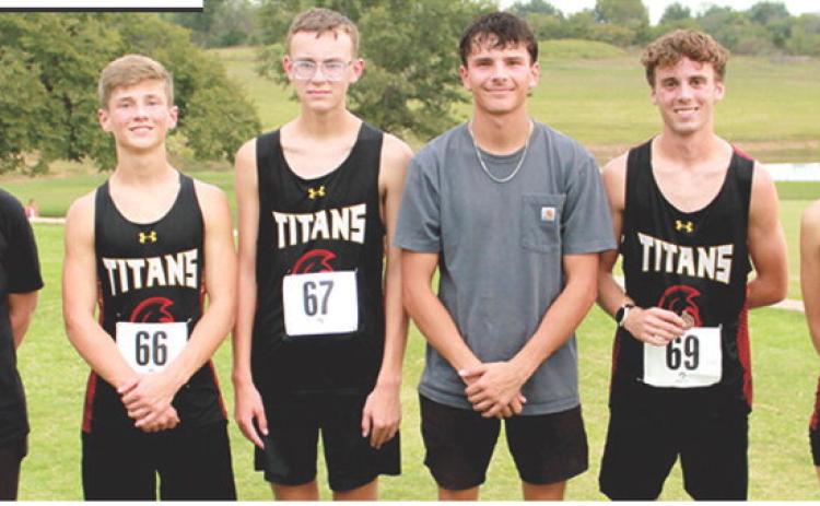 Titan Cross Country Head Coach Amanda Stickland and the Columbus Team hosted their invitational meet, Tuesday, at the Brush Creek Golf Course. Some members of the varsity team present for the photo were Eli Engelmen, freshman; Cooper Grundy, sophomore; Drake Laurance, senior; Levi Simpson, senior; and Cara Altis, senior. The team is scheduled to run at Independence, Thursday, in their final races before the CNC League Meet, October 15 at the Greenbush complex.