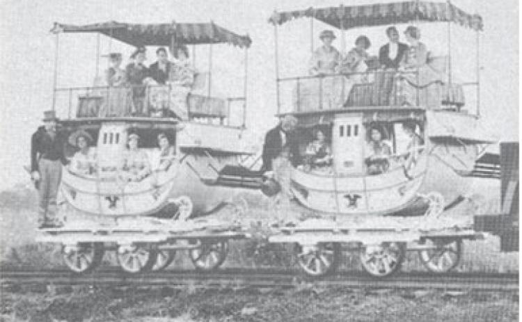 Many of the railway passenger carriages of the 1830s, bore a striking resemblance to the stagecoaches of that period. The bottom looked like a stagecoach and on top was an open-air “promenade deck” equipped with seats and awning, the last word in passenger train luxury.