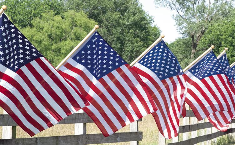 More than 50 flags decorate a fence in Cherokee County in recognition of Memorial Day. A time to remember those who gave their lives for America.