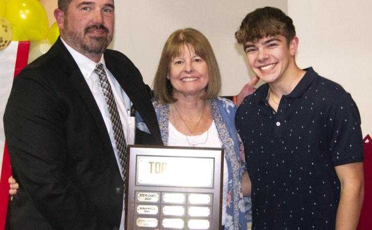 Columbus High School Principal Dan Grundy presented the Top Titan Award to Regina Jameson. She was nominated by Easton Long for the award.
