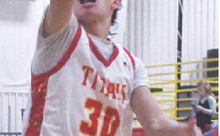 Titan Sophomore, Drake Laurance, lays in one of his multiple shots that resulted in forced turnovers by the Chargers. Drake had three consecutive layups to start the third quarter and build the Titans lead to 20 in the Tuesday win, 63-40, over Cherryvale in the CUHS Gymnasium.