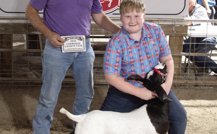 The Grand Champion Market Goat brought in a $1,600 premium during the Cherokee County Livestock Auction. Easton Haywood, Lone Elm Beavers 4-H club is the owner of the goat. The premium was paid by Columbus Veterinary Clinic, represented by Dr. Kurtis Gregory.