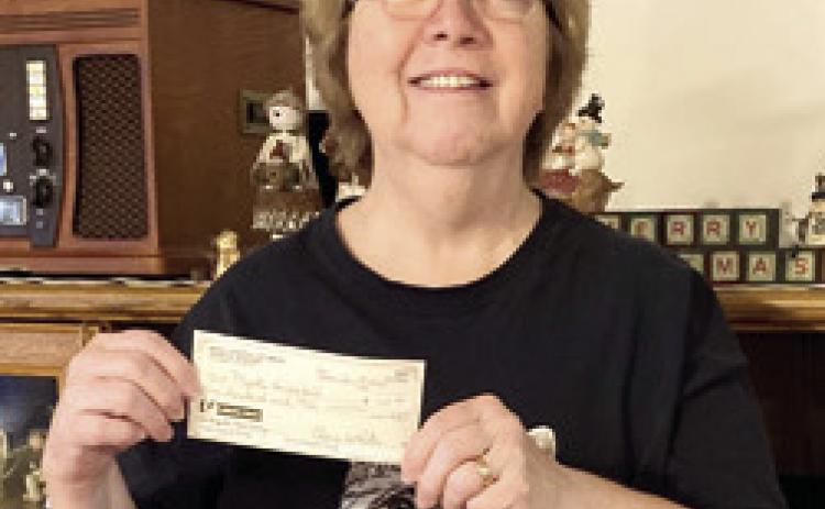 Myrtle VonWedell was the winner of the $100 prized in the drawings sponsored by Columbus Mercy Auxiliary. Winners were drawn at the December 19 meeting. Courtesy photo.
