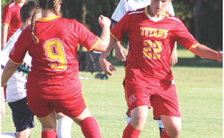 The Columbus Unified High School Soccer Team has had two games this season, against Thomas Jefferson Day School from Joplin, Mo. and Liberty Home School. The team is working hard and gives full effort on the pitch and off. Sophomore, Gabe Edwards, controls the ball after receiving a pass from senior, Taryn Billings, on their home pitch recently. The team is tentatively scheduled for a game with Parsons, today at 4 p.m. at the Central School Soccer Pitch.