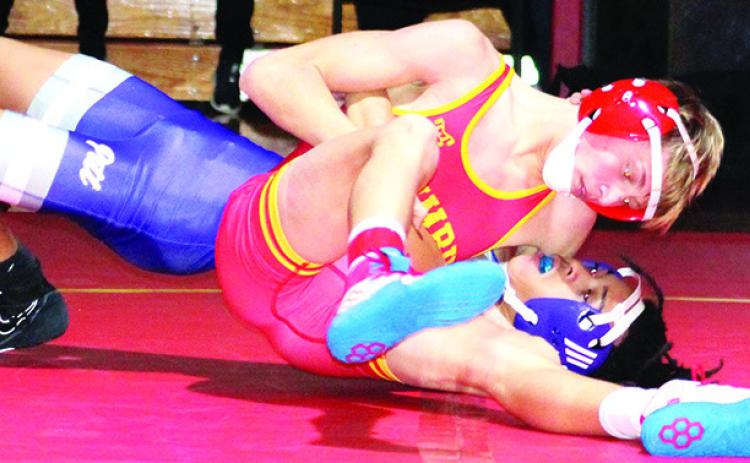Cal Saporito, Titan Sophomore, pinned his Pittsburg opponent in a dual on his home mats, Thursday. Cal won then 113-pound weight class but Columbus lost the dual, 20-44, to the Purple Dragons at the CUHS Gymnasium.