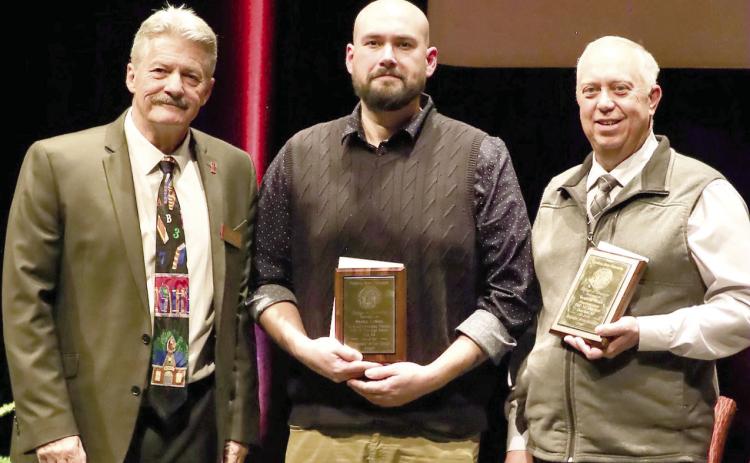 The PSU College of Education honored veteran administrator an accomplished teacher Dr. Brad Miner, (right) Superintendent at USD 247 in Cherokee with the Distinguished Service Award. In addition to Dr. Miner, Shawn LaSota (center) an English language teacher in Erie received the recognition. The awards were presented by Dean John Opplinger. Courtesy photo.