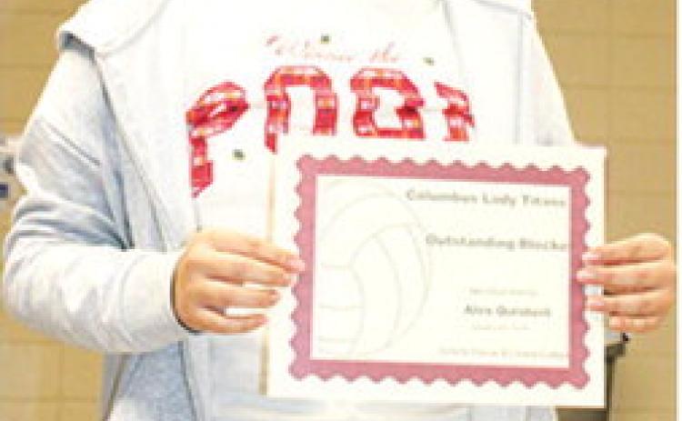 Lady Titan Senior, Alexandra Quisbert, received the award for Outstanding Blocking and Most Improved Award during the Lady Titan Volleyball end of season banquet at the Columbus Unified High School Gymnasium in October.