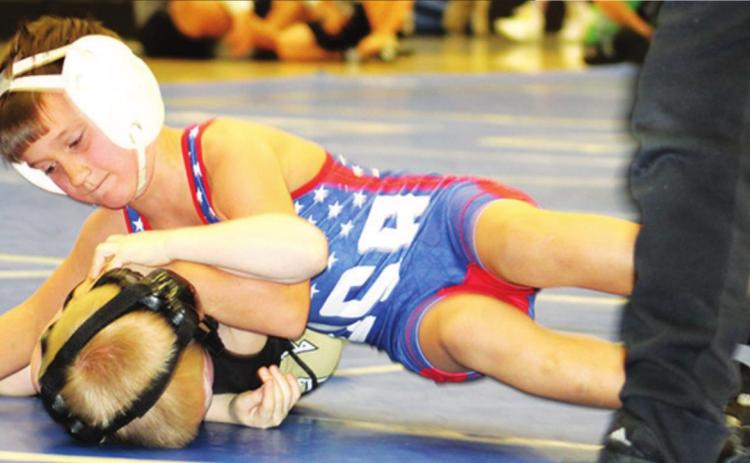 Briggs Johnson captured the only first place win for the Titan Wrestling Club in the 6U, 55A weight class at the Carthage Youth Wrestling Tournament, Saturday. Briggs took advantage of his first round by getting three pins and a major decision, on his way to the title. Courtesy Photo.