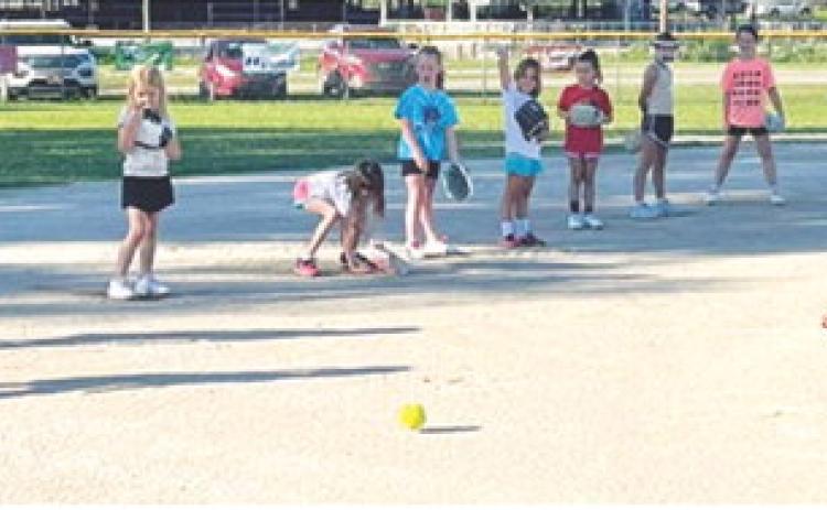 Young softball players learn skills