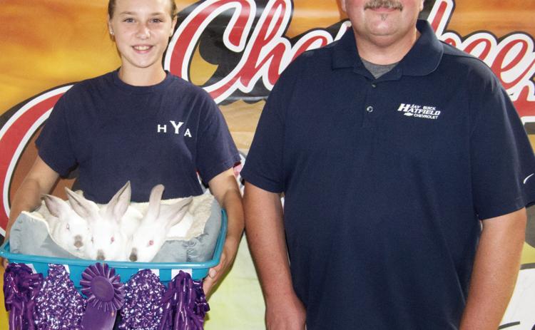 Heritage Youth Association member Katherine King received a $1,200 premium as the Grand Champion Rabbits from Jay Hatfield Motor Sports. She is the daughter Ross and Charla King, rural Columbus. There were just two entries in the Rabbit premium sale and they brought a total premium of $1,400.