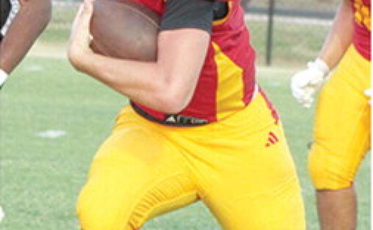 Cole Howard, Titans Junior Quarterback, ran in from 24 yards out for the first six Columbus points in the Titans 33-36 loss in their home opener against Independence, Friday at Titan Stadium .