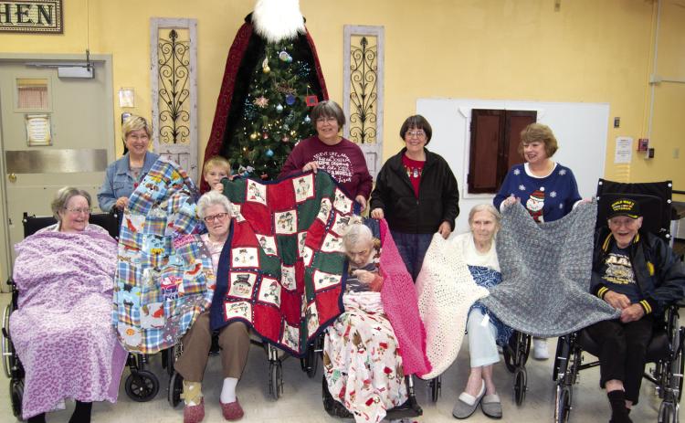 Residents at Medicalodges of Columbus will be a little warmer this year thanks to the Cherokee County Knitting Crocheting and Sewing Group. They provided blankets for the patients at the care facility. The patients accepting the gifts were Sally Saporito, Imy Jones, Jean Swain, Joanna Parsons, Ge Ge Sachetta. Those delivering the handiwork were Cindy Gleason, Jacob Holden, Gina Peak, Joleen Walden and Karen Langerot.