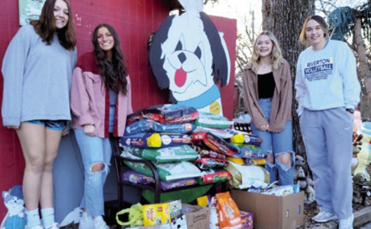 Riverton High School students collected over 360 pounds of dog and cat food for a no kill animal shelter. This was one of their projects for “Community Day of Giving.” Courtesy photo.