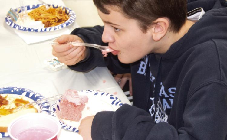 A very successful spaghetti fundraiser for Jon Tavernaro in the Weir Community Center on Saturday. Blake Sanders enjoyed a bit of cake to finish off the meal.