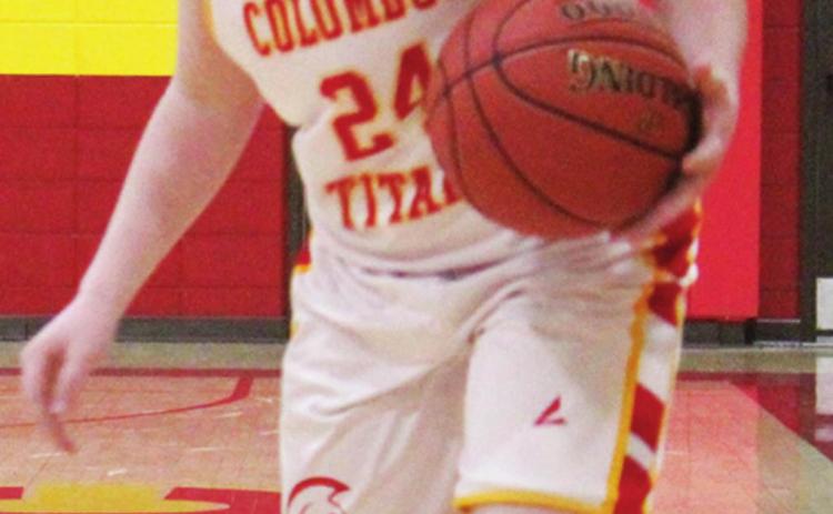 Jett Tanner brings the ball down in the Central Titan 7A Team loss to St. Mary’s-Colgan, 42-14, Tuesday at the Columbus High School Gymnasium.
